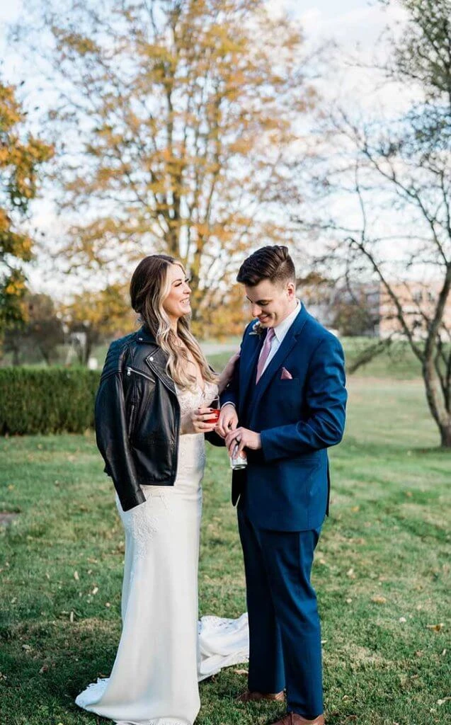 real stella york bride and groom sharing a drink