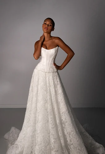 Bride wearing strapless lace wedding dress with scoop neckline