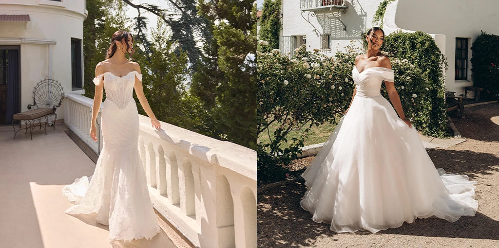 Two brides posing wearing their wedding gowns