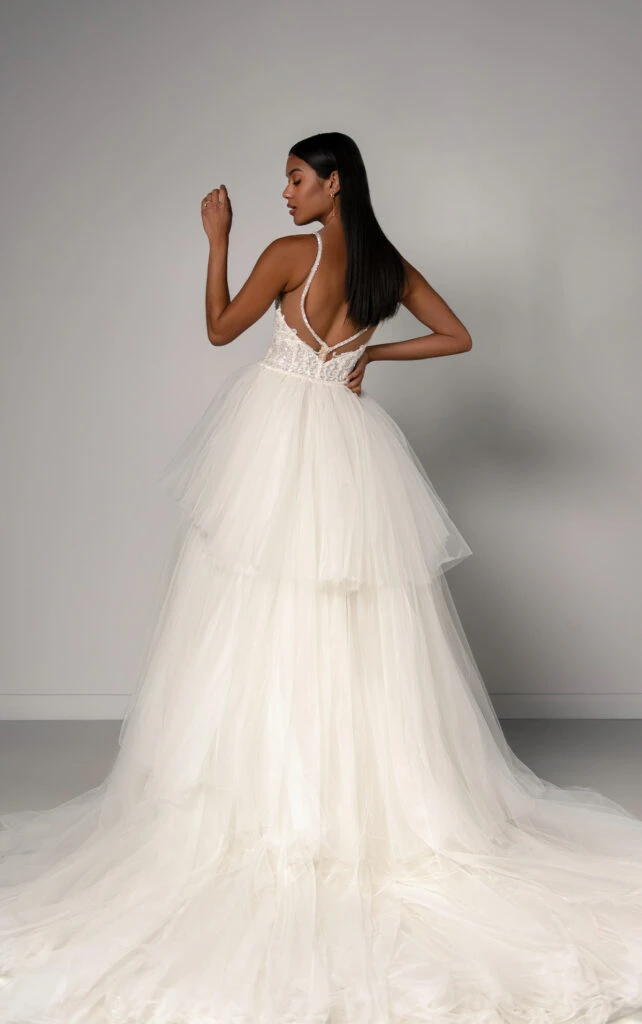 Bride wearing tulle wedding dress with open back