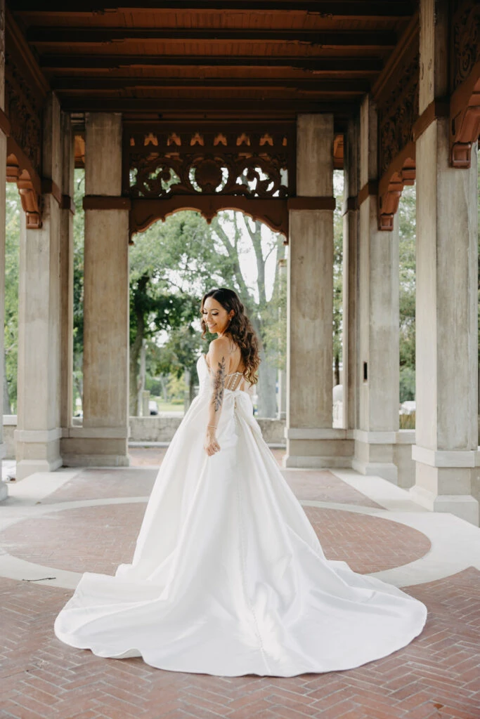 real bride olivia posed looking over shoulder - Style 7711 by Stella York