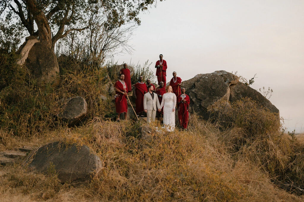 sophie and tom posing with an indigenous tribe in the serengeti - layne by All Who Wander