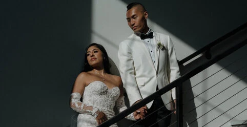 real bride angie posing on stairs with husband - 1367 by Martina Liana