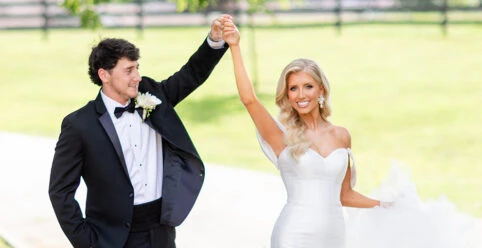 real bride Jadah holding hands with husband - 1611 by Martina Liana