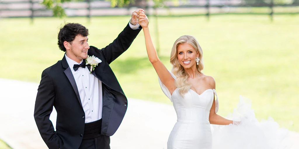 real bride Jadah holding hands with husband - 1611 by Martina Liana
