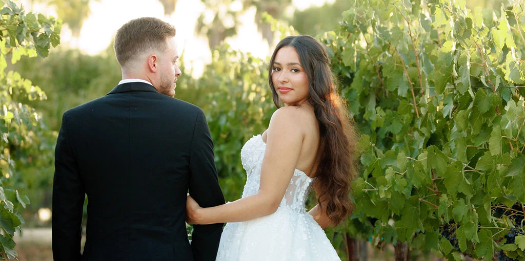 real bride mailin posed with husband in garden - Style 1483 by Martina Liana