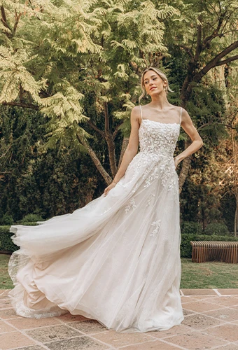 Bride wearing lace a-line wedding dress in garden