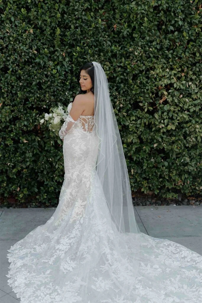 real bride angie posing showing the low back on 1367 by Martina Liana