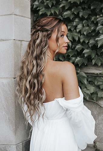 bride looking to the side wearing simple chiffon off the shoulder wedding dress - d3636 by Essense of Australia