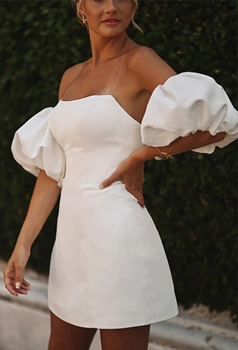 bride wearing simple short wedding dress posing with hand on hip - D3957 by Essense of Australia