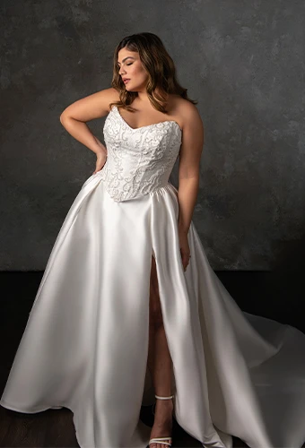 Bride wearing strapless drop waist ballgown wedding dress with corset bodice