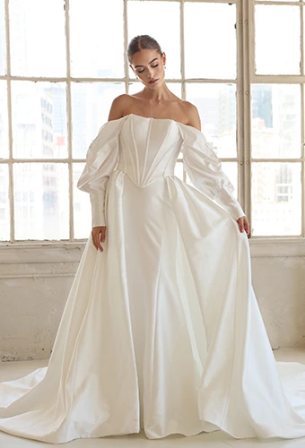 bride standing in front of warehouse windows holding over skirt out - LE1391 by Martina Liana Luxe