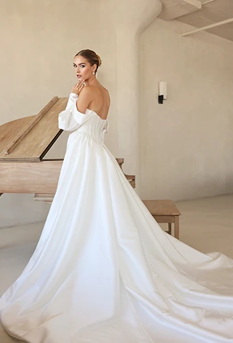 bride facing away from camera in front of piano wearing LE1391 by Martina Liana Luxe