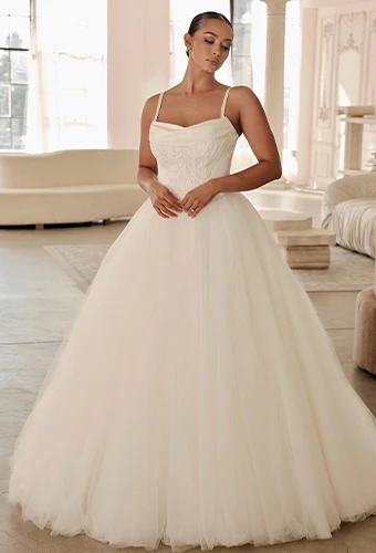 Bride wearing ballgown wedding dress with spaghetti straps