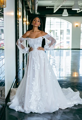 bride posing with hands on hips wearing D4029 by Essense of Australia