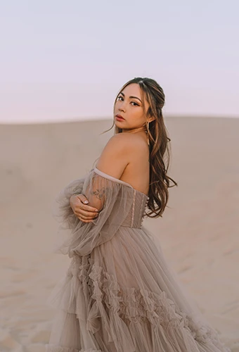 bride wearing tan wedding dress with tulle off the shoulder sleeves - sutton by All Who Wander
