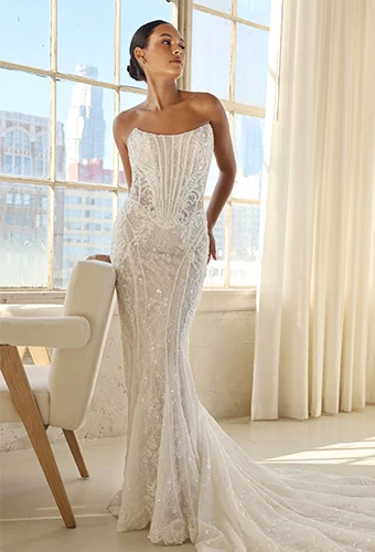 Bride wearing art deco strapless wedding dress with sparkling lace and scoop neckline