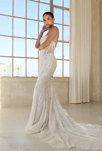 Bride wearing art deco strapless wedding dress with sparkling lace and scoop neckline