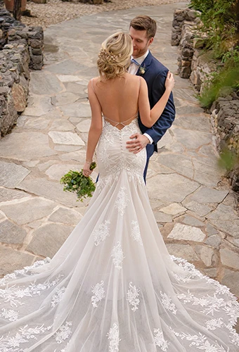 Bride wearing mermaid wedding dress with open back