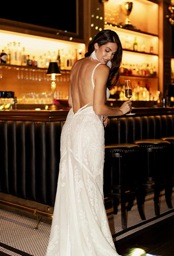Bride wearing lace wedding dress with open back