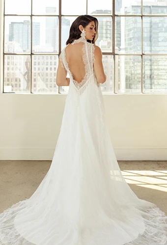 Bride wearing lace wedding dress with open keyhole back