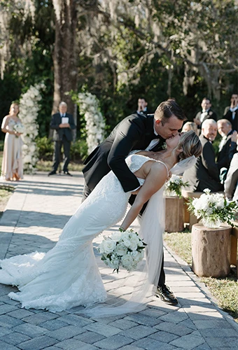 Real bride Carli embracing her husband