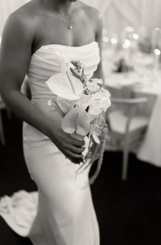 True bride Erica posing with a bouquet