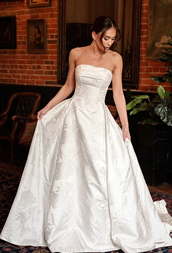 Bride wearing strapless jacquard wedding gown