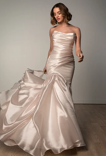 Bride wearing strapless wedding dress with skirt detail
