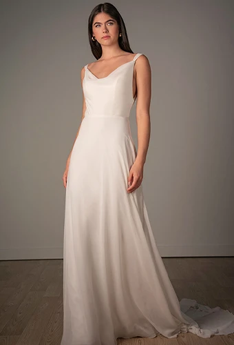 Bride wearing simple chiffon wedding dress with open back