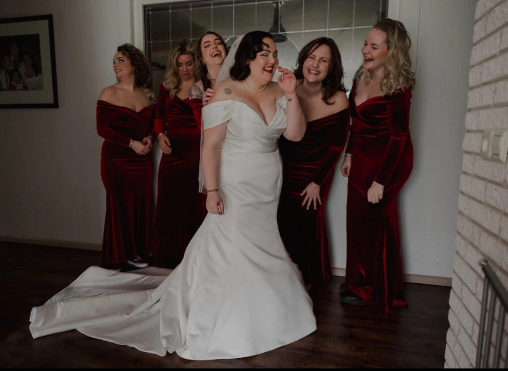 True bride Priscilla posing with her bridesmaids