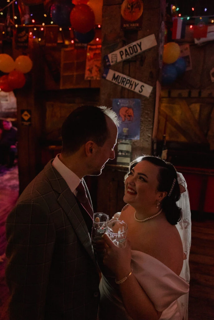 Real bride Priscilla posing with her husband