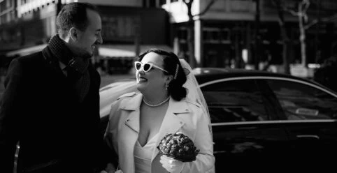 Real bride Priscilla posing with her husband on her wedding day