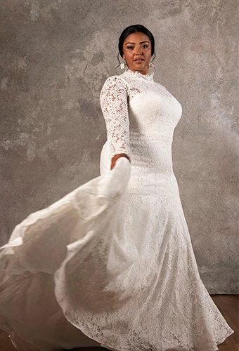 Plus size bride wearing lace long sleeve wedding dress