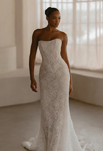 Bride wearing strapless column wedding dress with all over lace