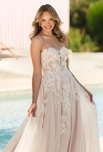 Bride wearing blush lace wedding dress