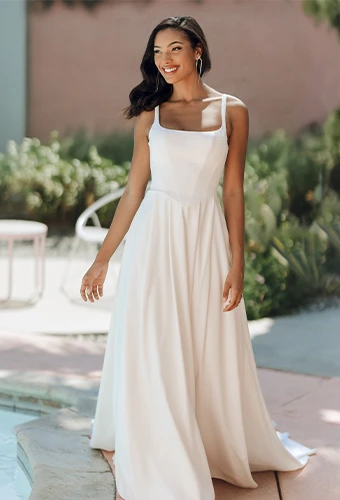 Bride wearing simple mikado wedding dress with square neckline