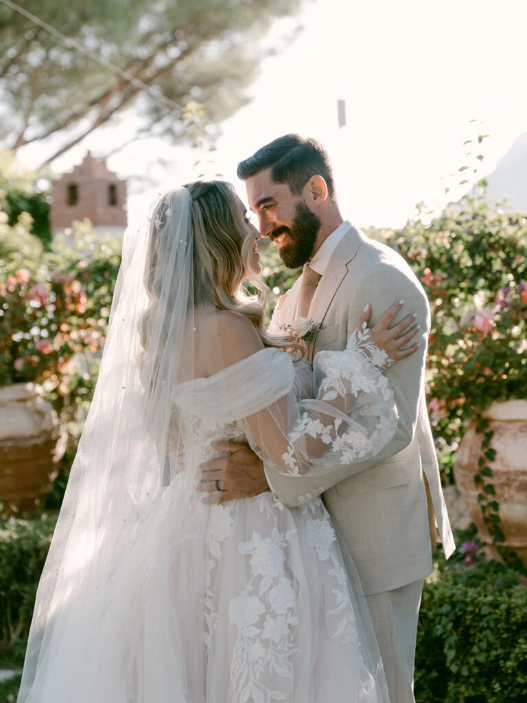 Real bride Emily embracing her husband