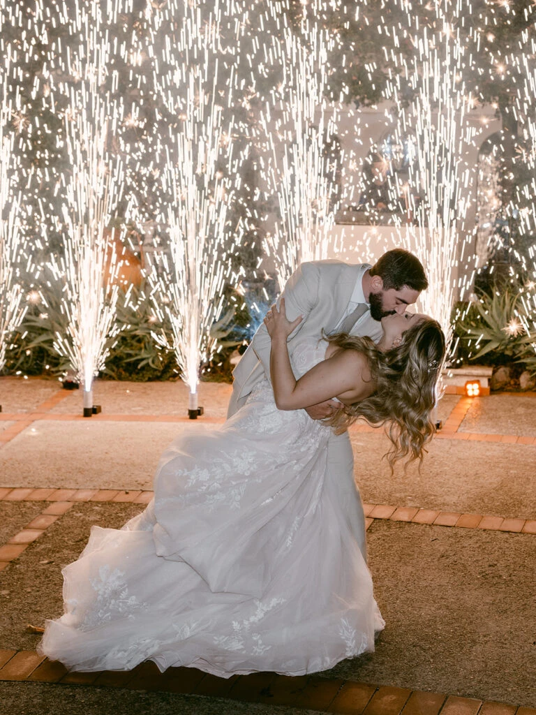 Real bride Emily embracing her husband