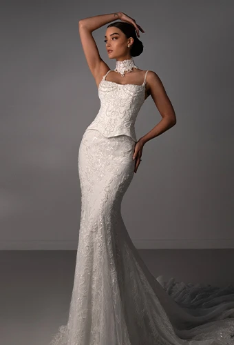 Bride wearing fit-and-flare wedding gown with sparkling lace and beading