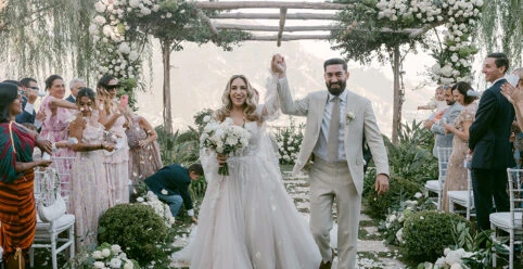 Real Bride Emily and her husband celebrating their wedding ceremony