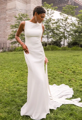 Bride wearing simple wedding dress with boat neckline