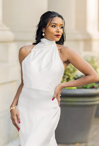 Bride wearing simple wedding dress with halter neckline