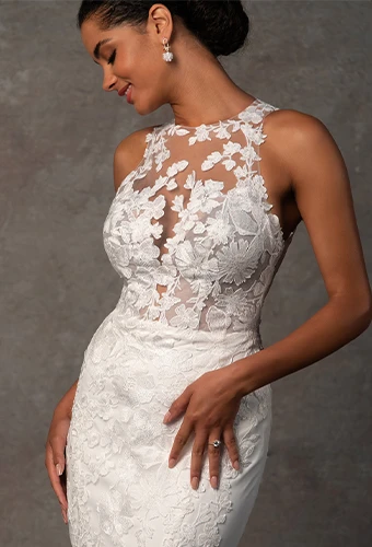 Bride wearing lace wedding dress with illusion neckline