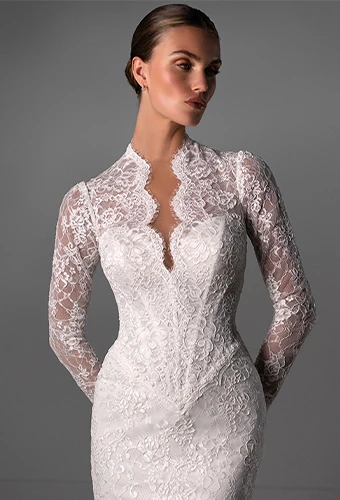 Bride wearing lace wedding dress with plunging v-neckline