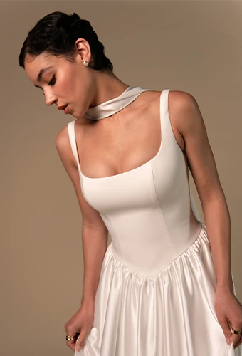 Plus size bride wearing simple wedding dress with square neckline