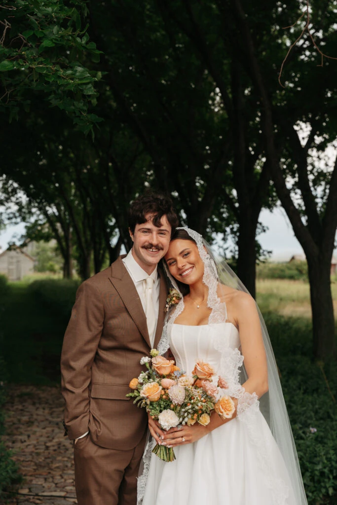 Real bride Gabby posing with her husband