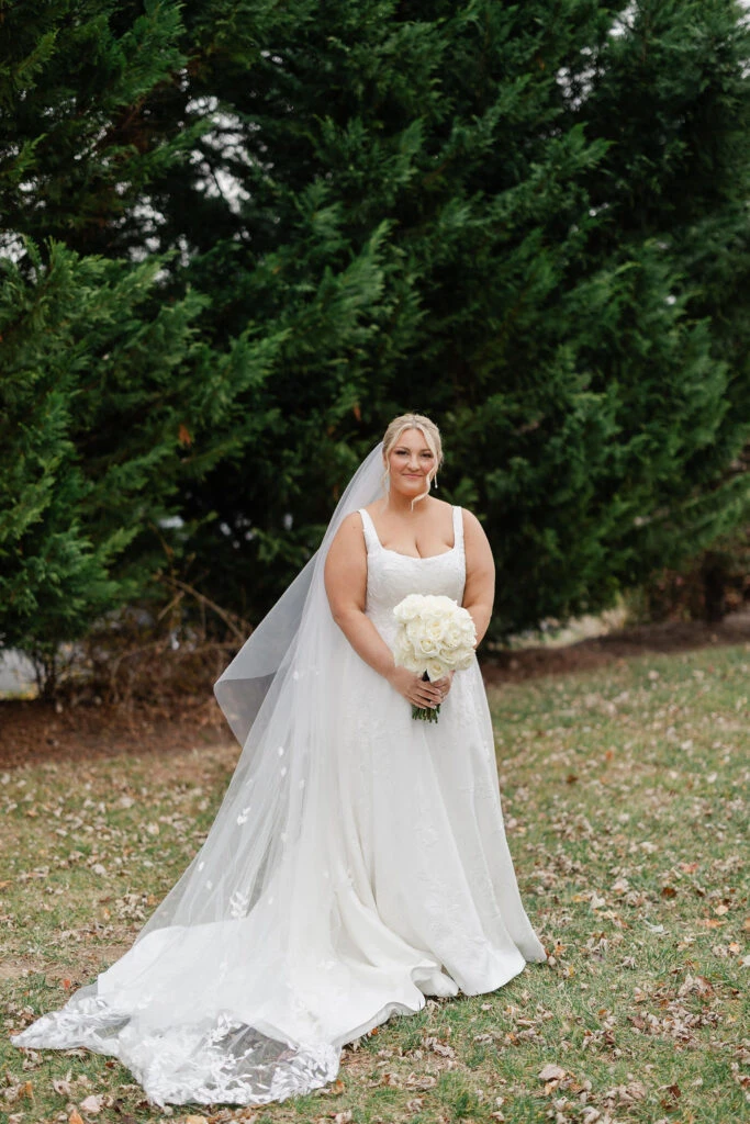 Real bride Alicia posing in her wedding gown