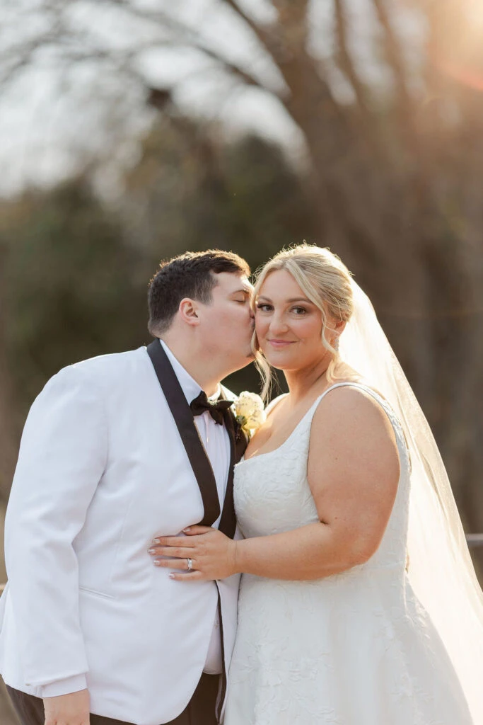 Real bride Alicia embracing her husband