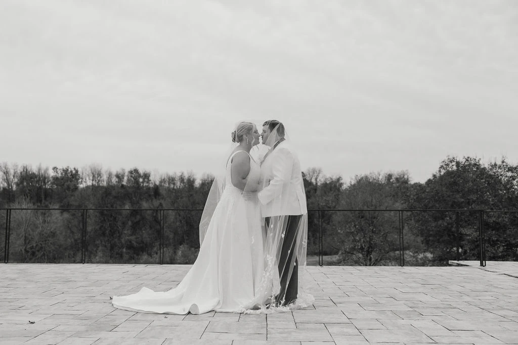 Real bride Alicia posing and embracing her husband